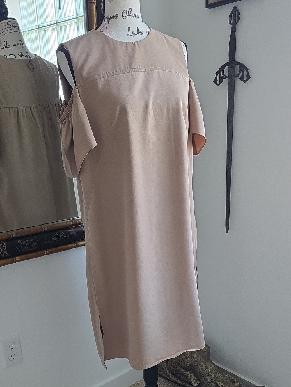 Akris Punto cold shoulder shift dress.